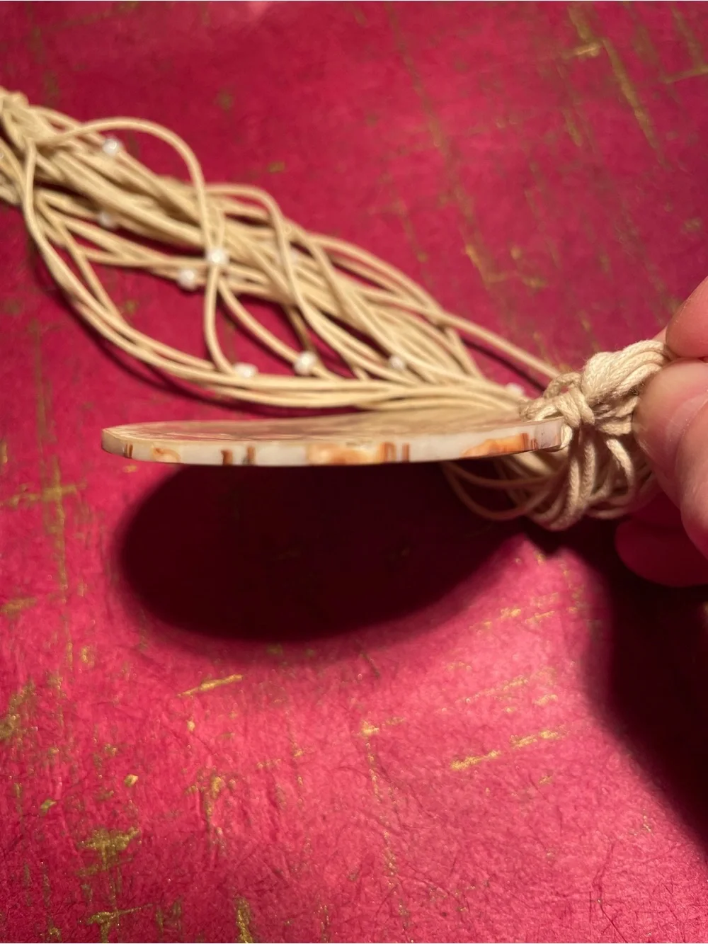 Handcrafted Cream Multi-Strand Necklace with Round Pendant